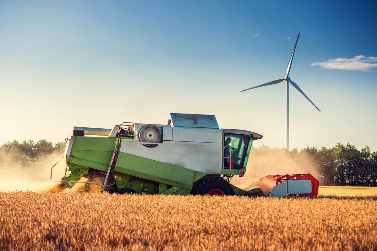 tractor-harvest-wheat-farm-wind-turbine.jpg